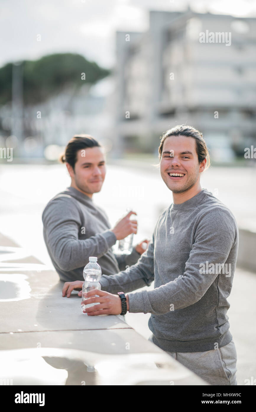 Portrait identical adult male twins hi-res stock photography and images ...