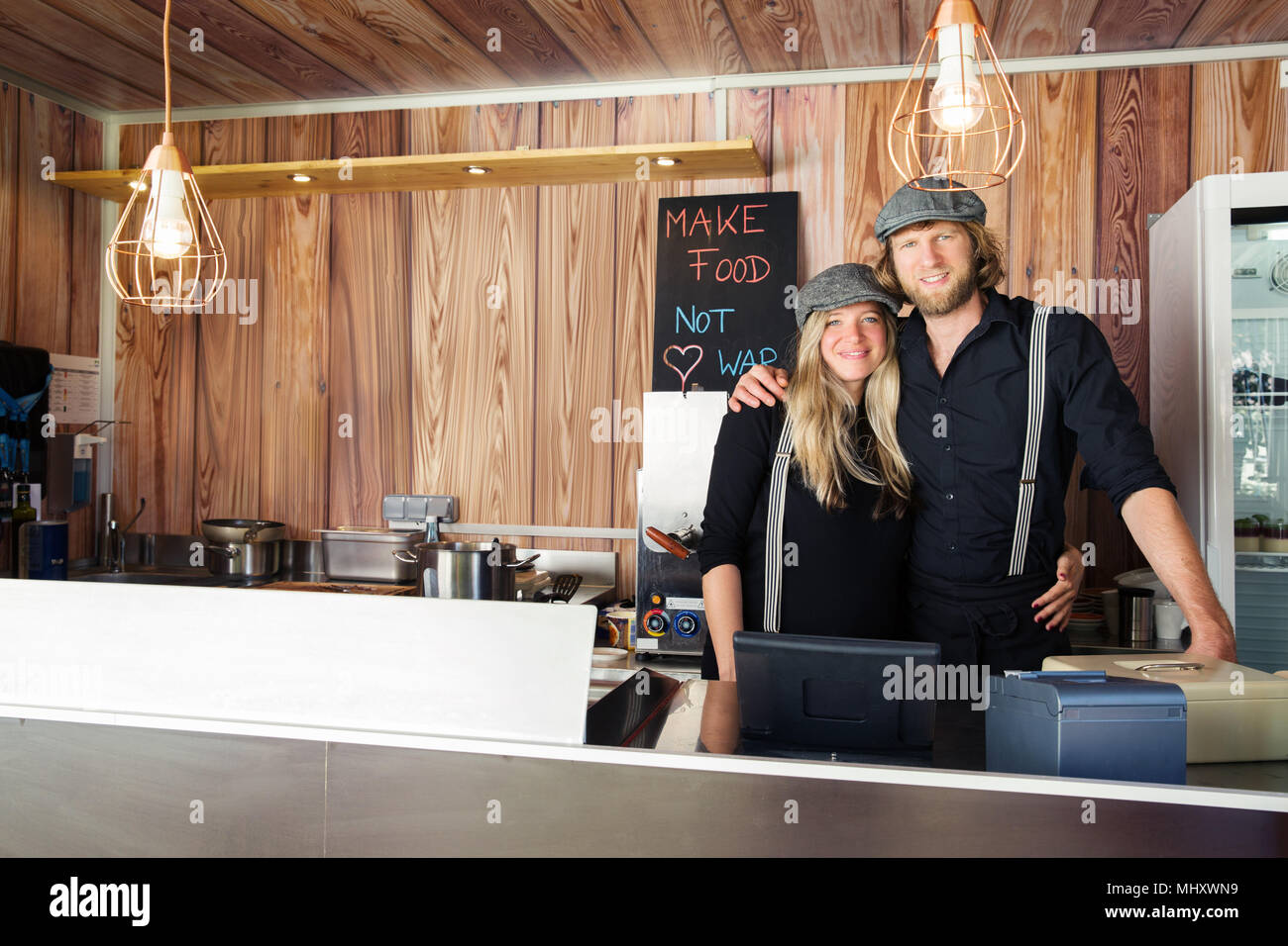 Couple owners in their food truck Stock Photo