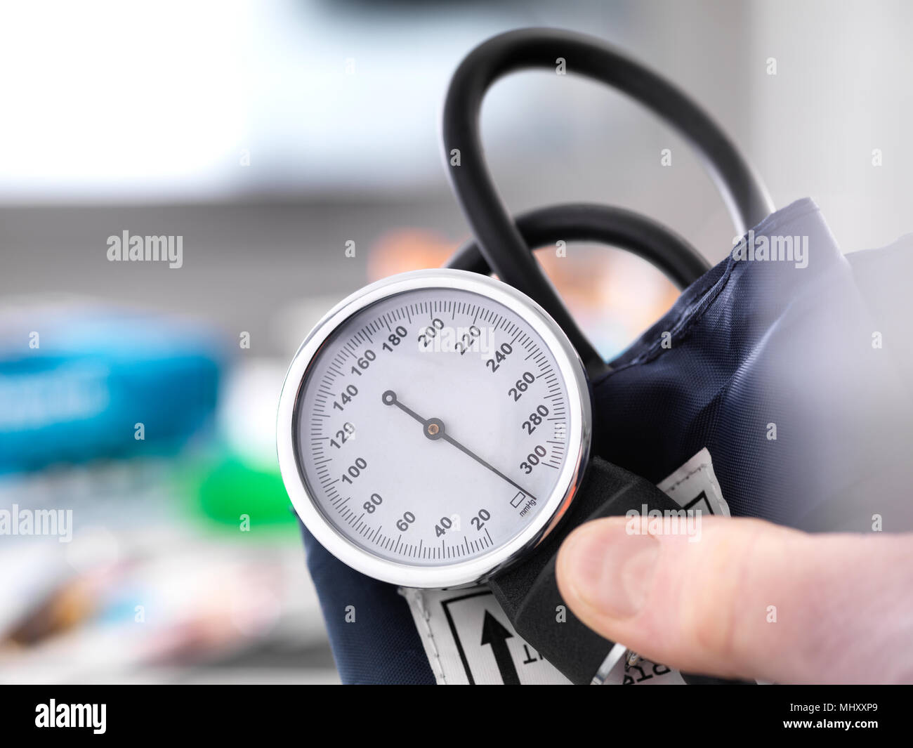 Cropped view of doctor holding blood pressure gauge Stock Photo