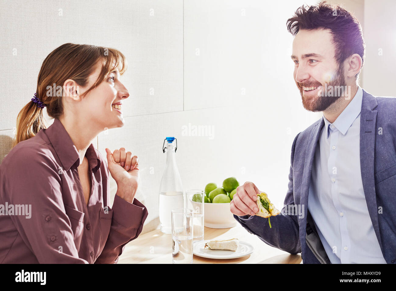 Colleagues having lunch smiling Stock Photo