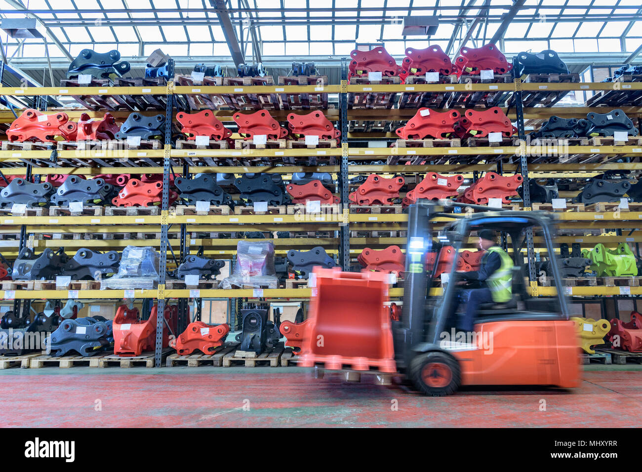 Forklift with product in storage area in engineering factory Stock Photo