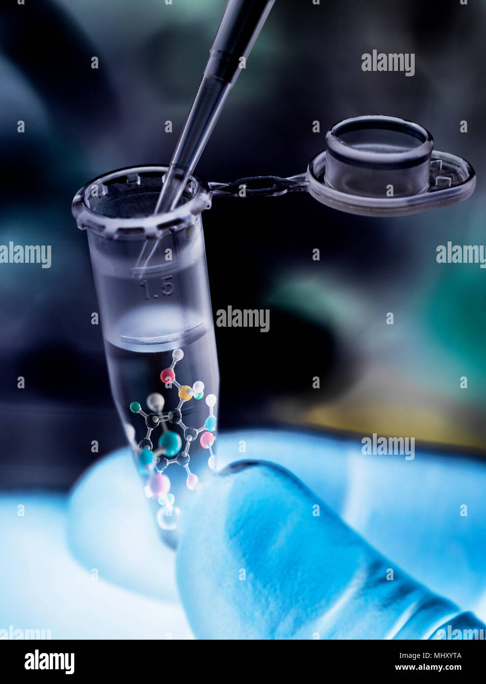Scientist pipetting sample into vial with molecular structure of formula Stock Photo