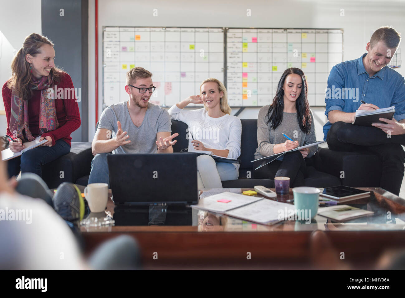 Male and female colleagues having brainstorming meeting in office Stock Photo