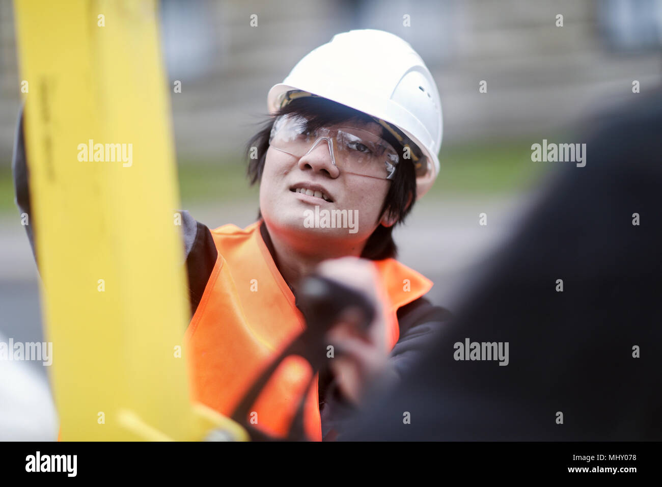Young construction worker wearing hard hat Stock Photo