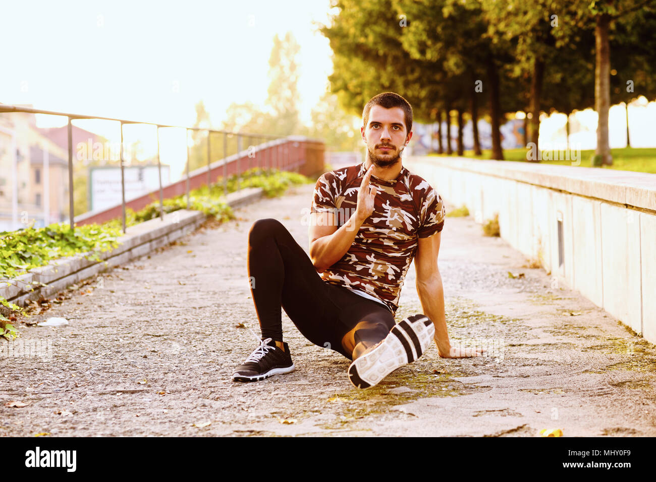 Stretching man sports hi-res stock photography and images - Alamy
