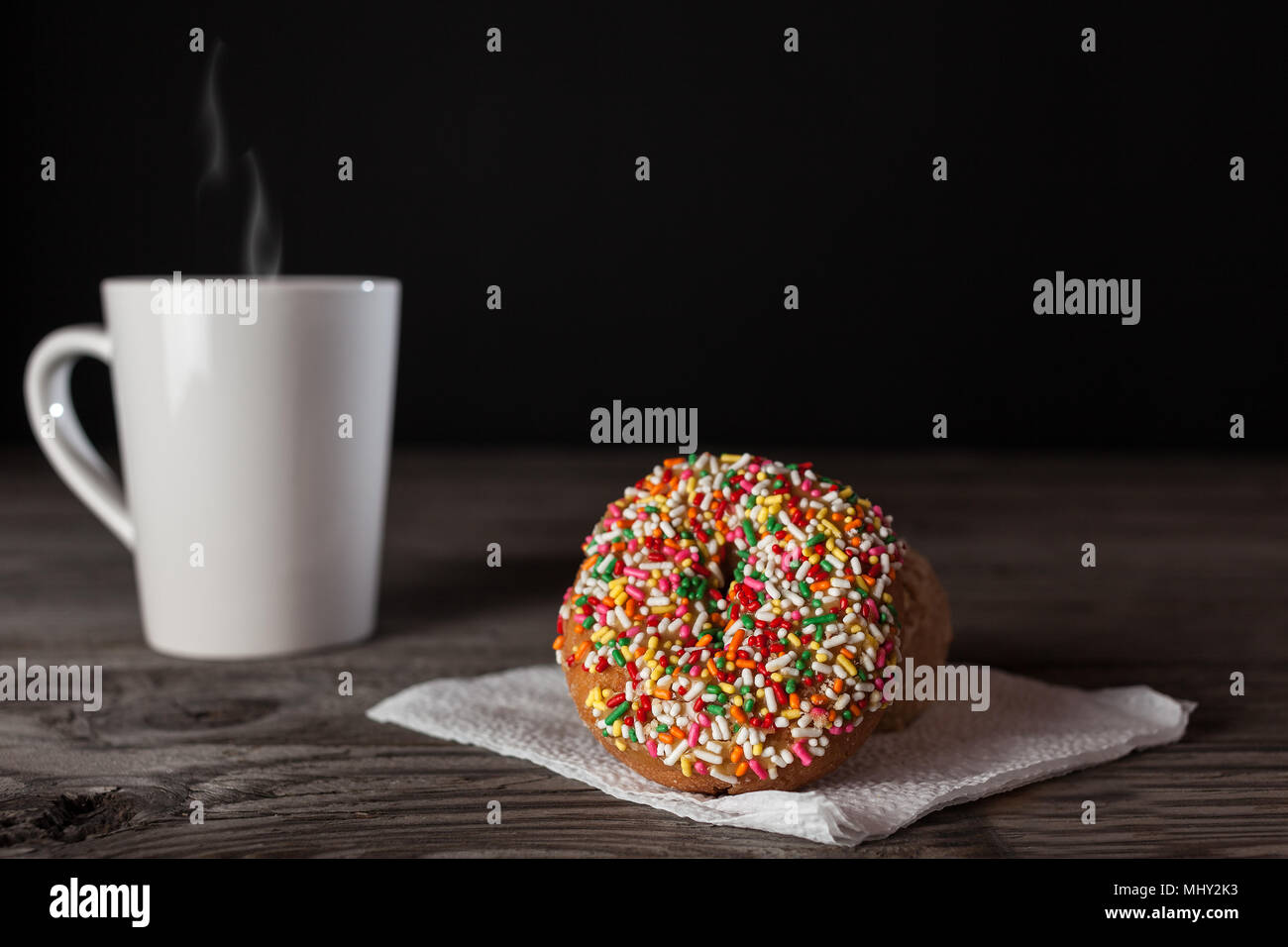 donuts of various size color and shape.  copy space in frame. Stock Photo