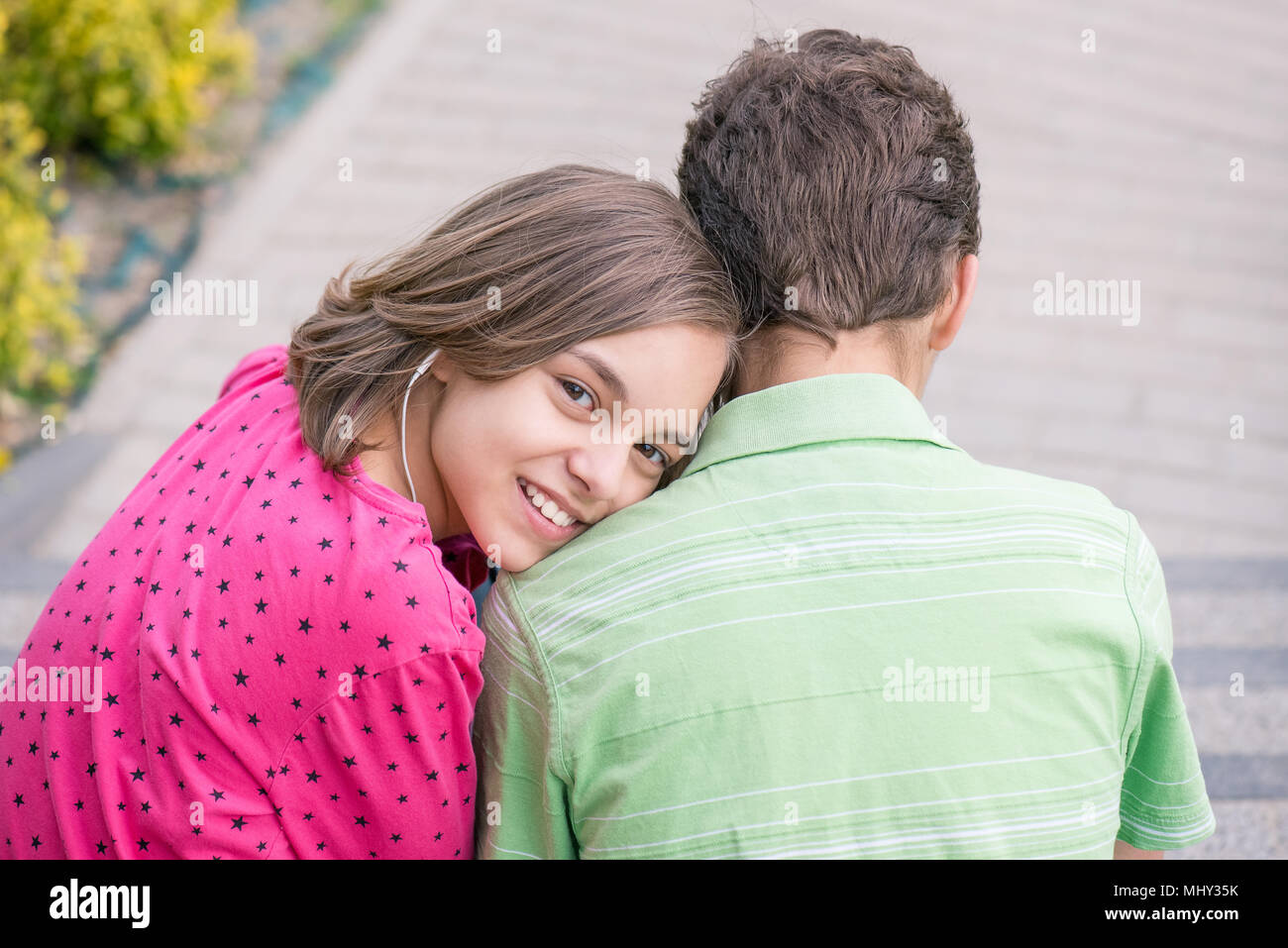 Teen boy and girl with headphones Stock Photo Alamy