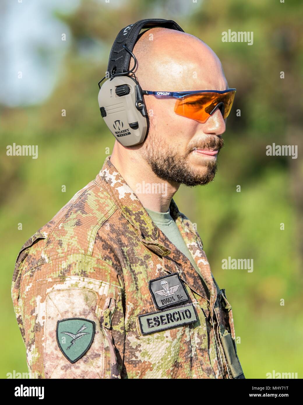 Italian Army Soldier on range at the 47th Winston P. Wilson (WPW) and 27th Armed Forces Skill at Arms Meet (AFSAM) at Robinson Maneuver Training Center, Ark, 2018, April 30, 2018. The Italian competitors were not able to bring over their Beretta ARX 160 rifles and had to learn how to use a new rifle platform for the competition. () Stock Photo