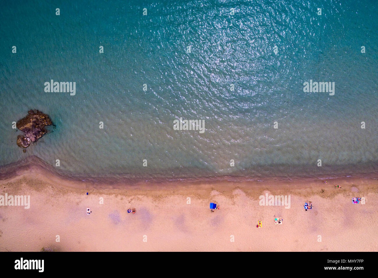 Panoramic drone view of  the beach at Greek town of Tolo Stock Photo