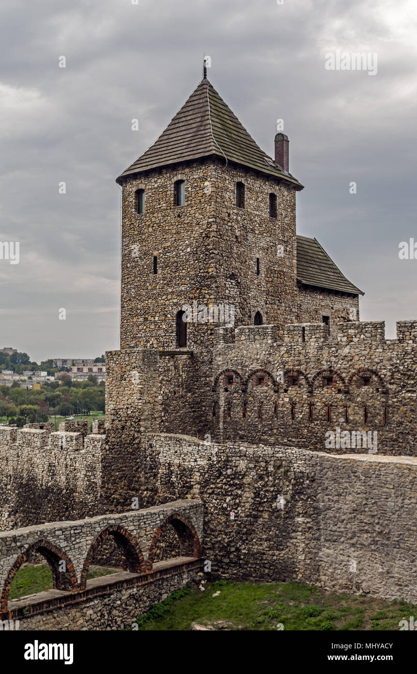 Medieval roman feudal castle fort tower on the hill beneath cloudy steel sky in Bedzin, Silesian Upland, Poland. Stock Photo