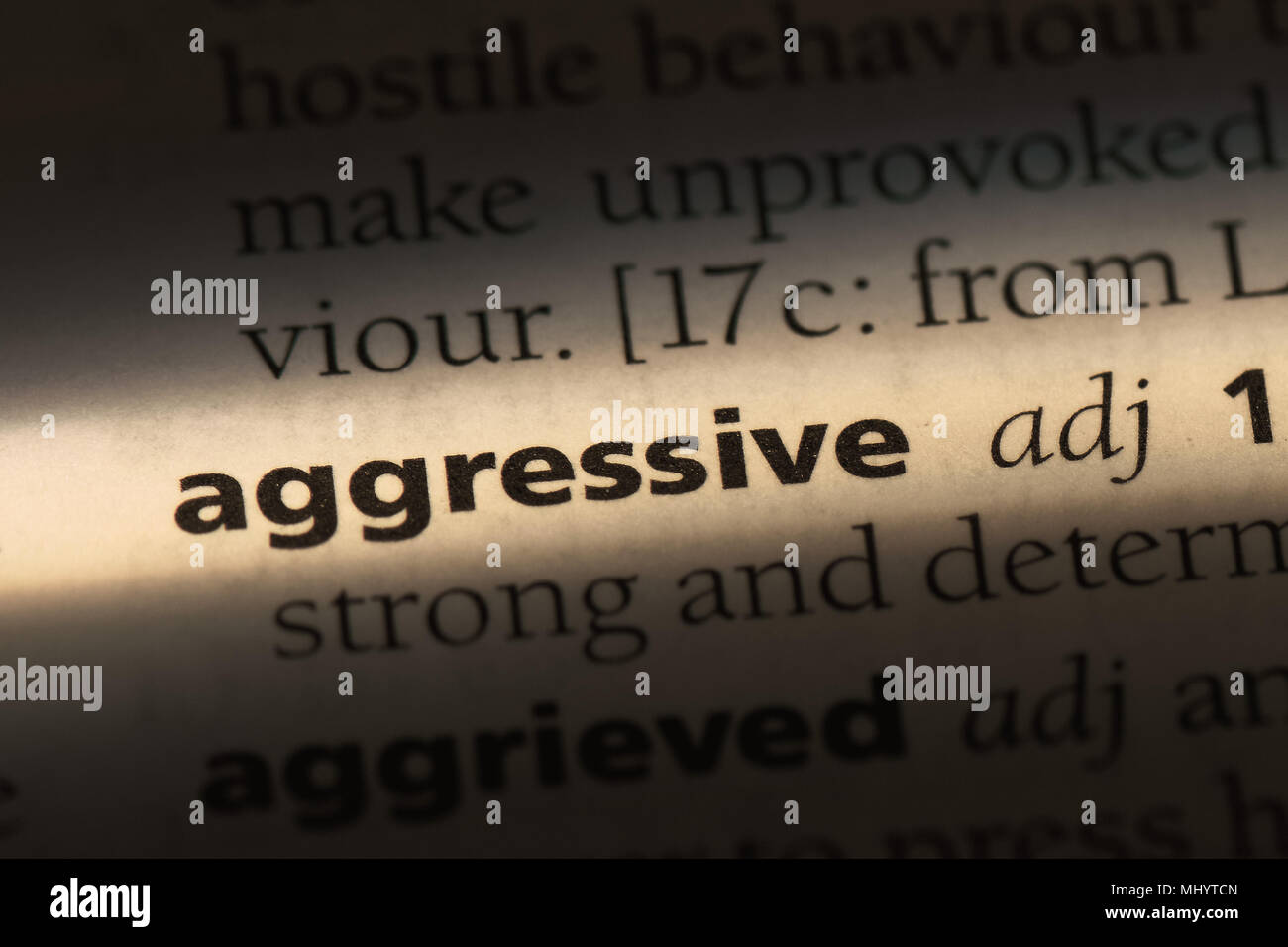 aggressive word in a dictionary. aggressive concept Stock Photo - Alamy