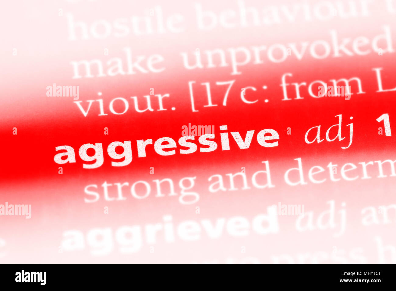 aggressive word in a dictionary. aggressive concept Stock Photo Alamy