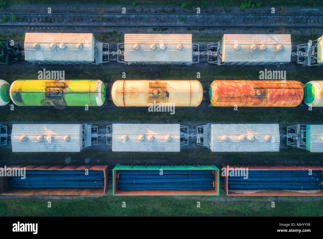 Aerial view of railway wagons. Cargo trains. Top view of colorful