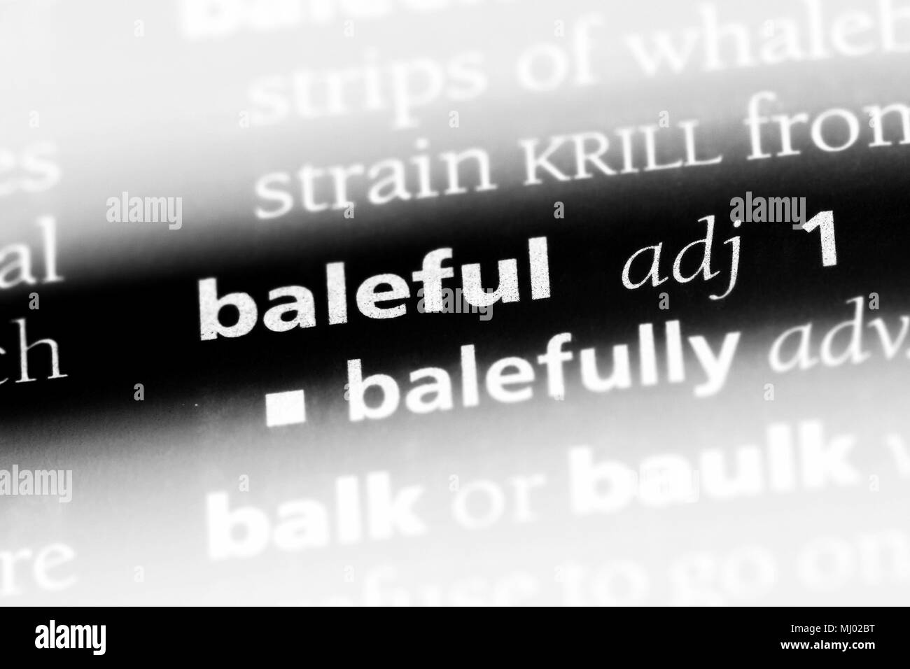 baleful word in a dictionary. baleful concept Stock Photo Alamy