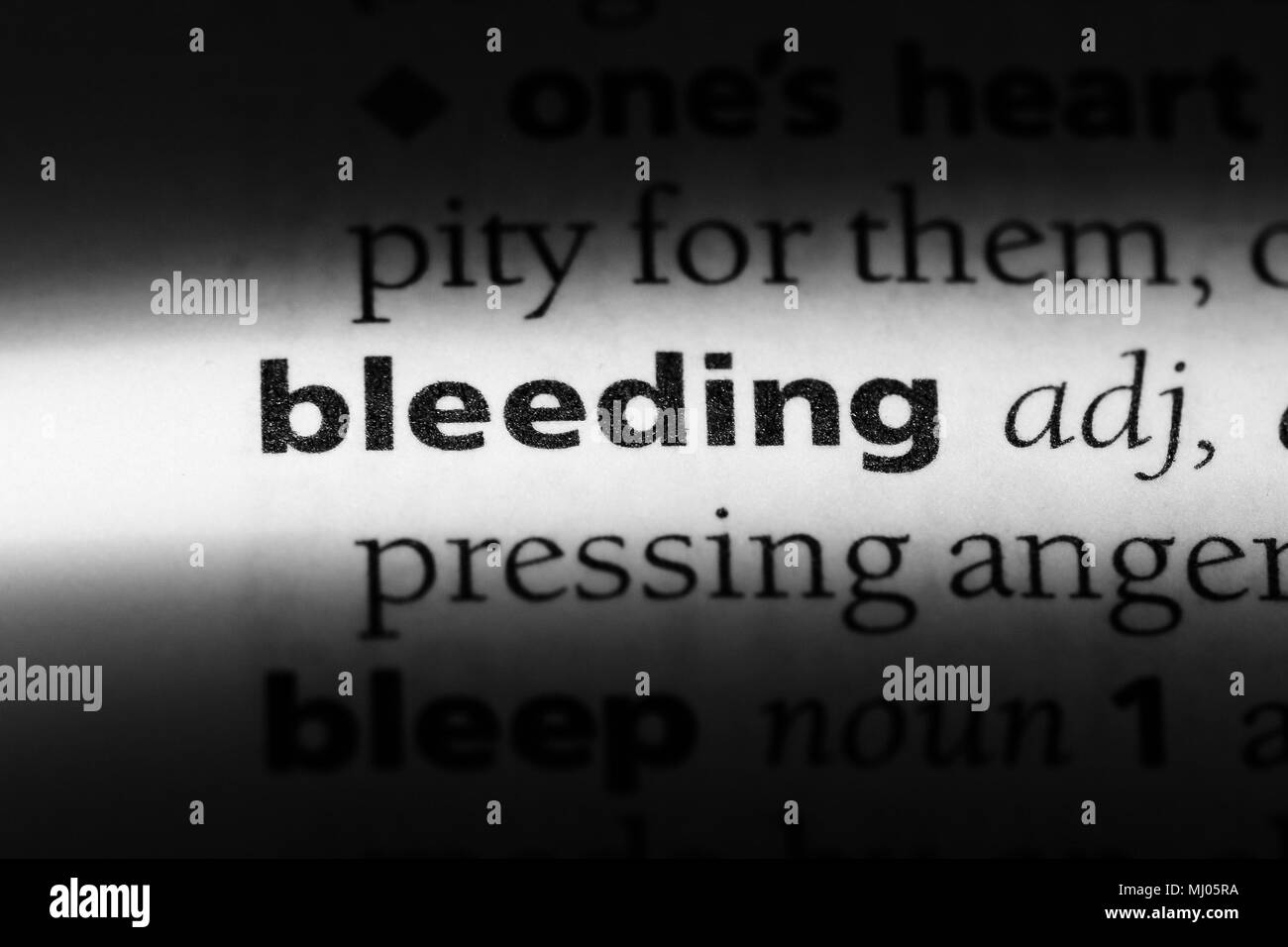 bleeding word in a dictionary. bleeding concept Stock Photo Alamy