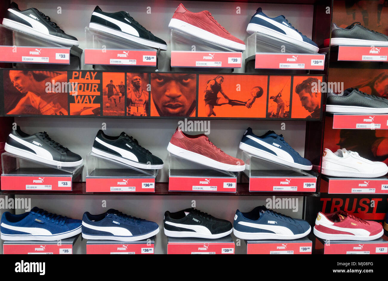 Religious Elementary school repose Puma training shoes in Sports Direct store. UK Stock Photo - Alamy