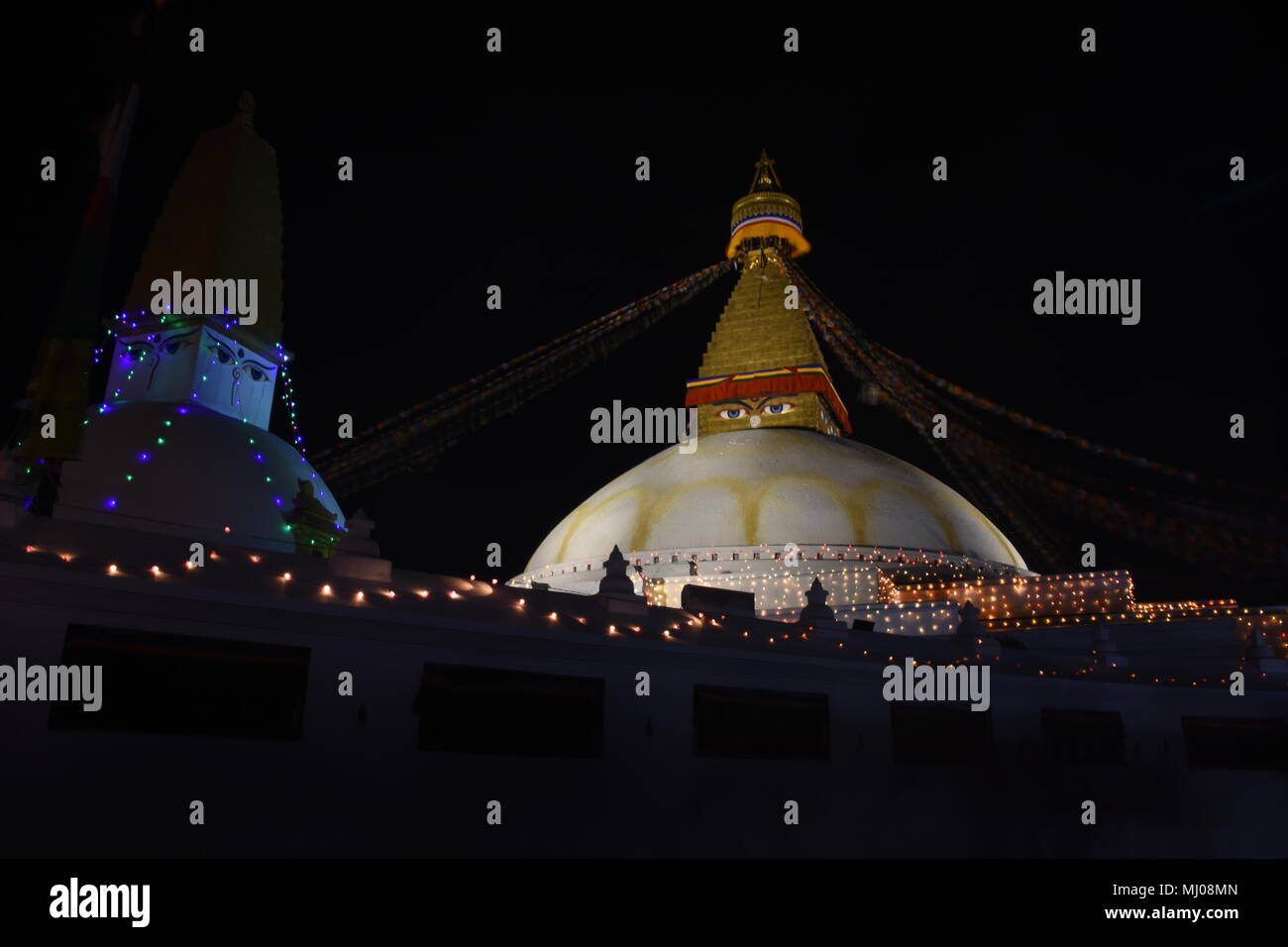 Illuminated Bouddha stupa at night, Kathmandu, Nepal Stock Photo