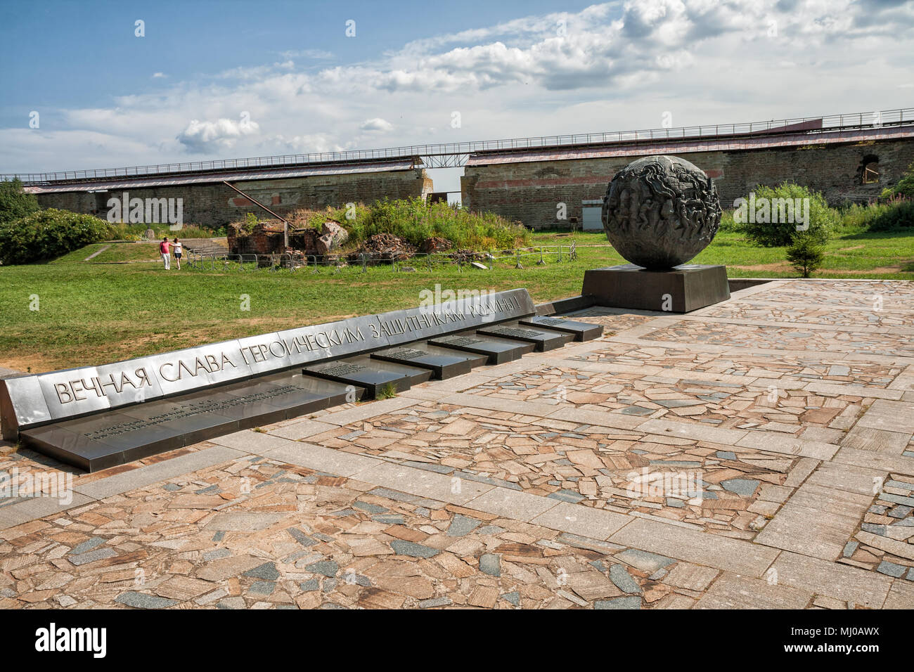 SHLISSELBURG, RUSSIA - AUGUST 02, 2014: People visit monument to heroic defenders of Oreshek Fortress in Great Patriotic War. Inscription on plate 'Et Stock Photo