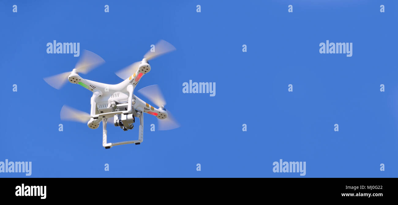quadrocopter close-up against the blue sky.  quadcopter which shoots 4k video Stock Photo