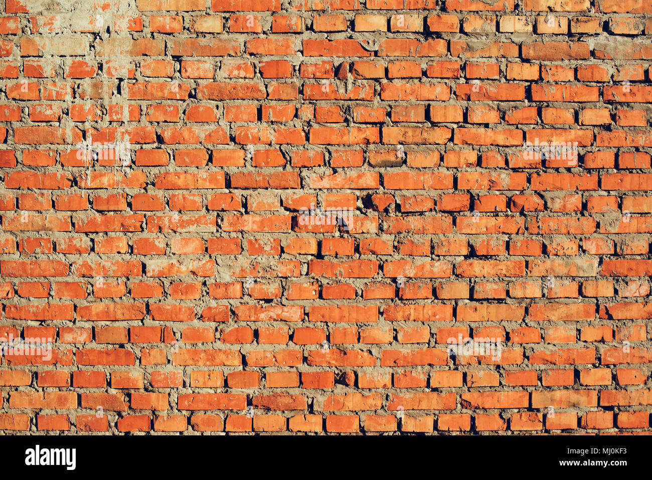Bricks and mortar ready for stucco application, grunge texture as background Stock Photo