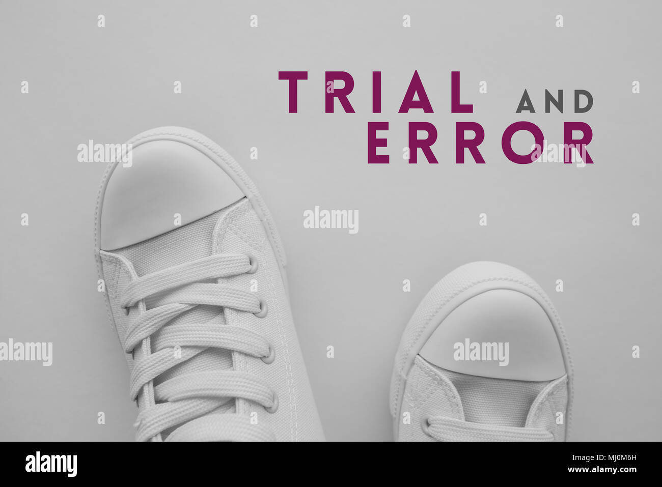 Trial and error problem solving concept with youth lifestyle type sneakers from above Stock Photo