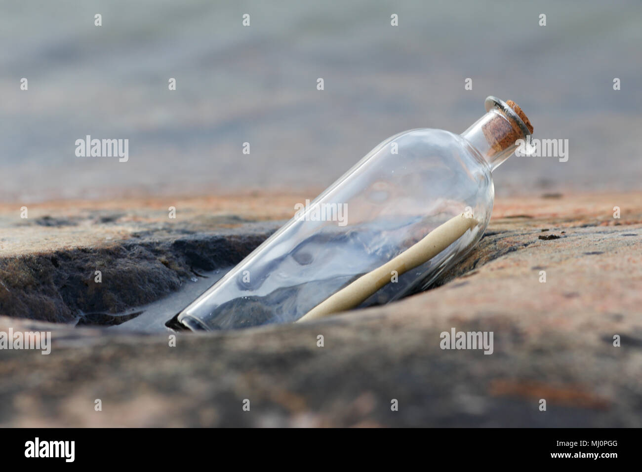 One bottle post has arrived with a message. Stock Photo