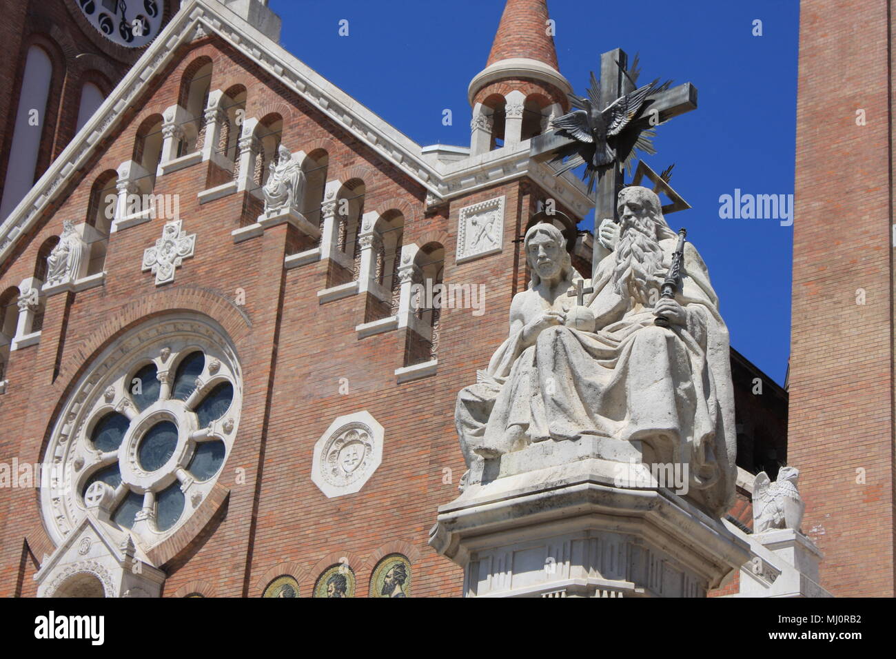 The Votive Church and Cathedral of Our Lady of Hungary is a twin-spired roman catholic cathedral in Szeged, Hungary. It lies on Dom Ter square beside Stock Photo