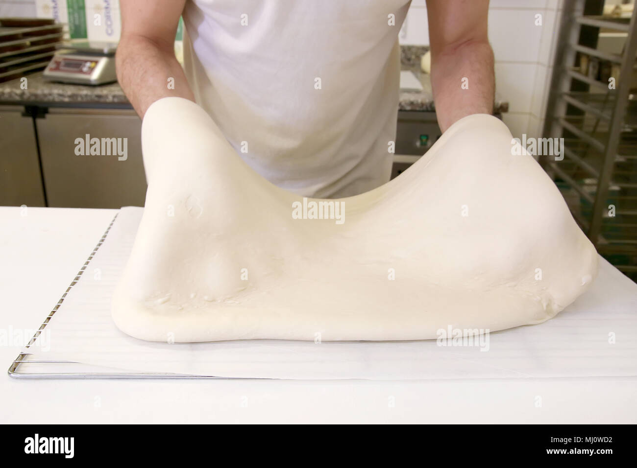 Making dough by male hands at bakery Stock Photo - Alamy
