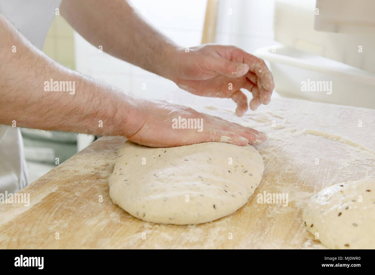 Making dough by male hands at bakery Stock Photo - Alamy