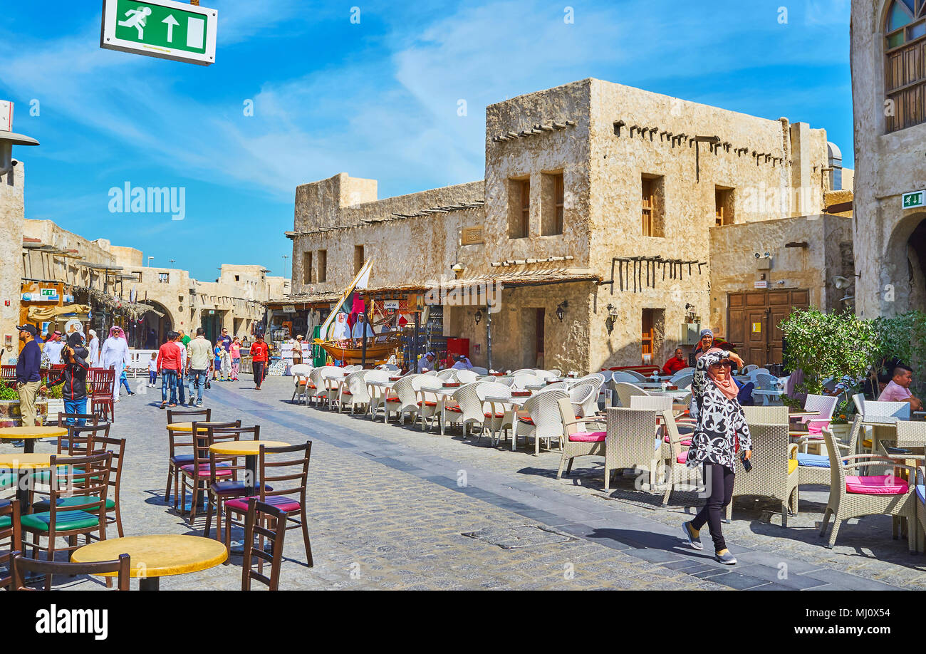 DOHA, QATAR FEBRUARY 13, 2018 Rows of outdoor cafes in Souq Waqif