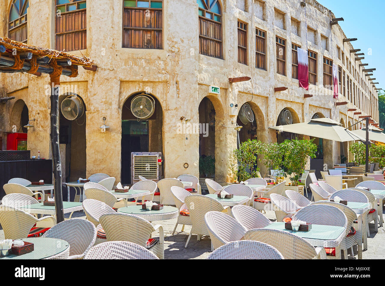 The nice open air terrace of the restaurant in historical neighborhood of Souq Waqif, Doha, Qatar. Stock Photo