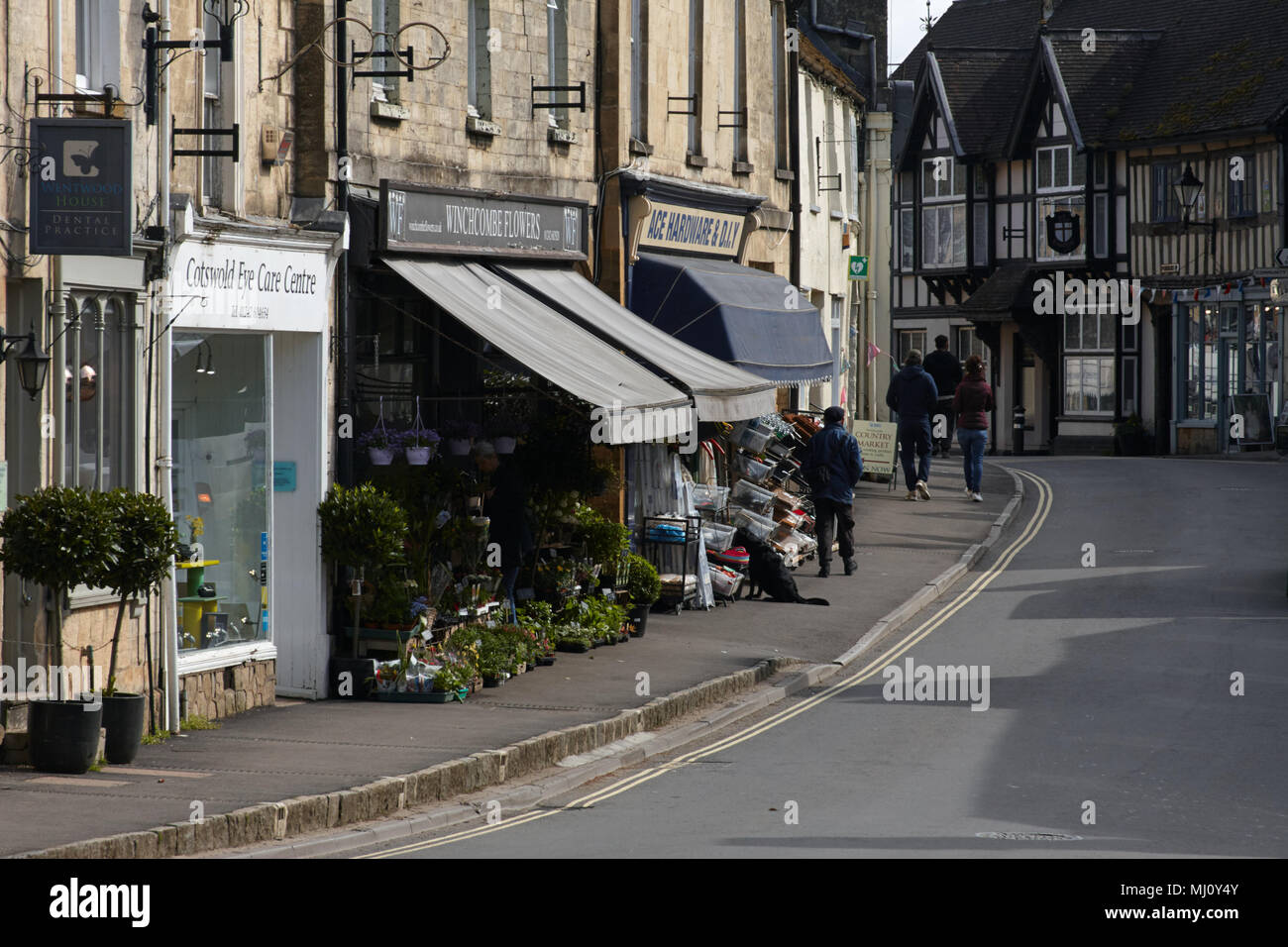Shops and pedestrians / shoppers on the high street of the Cotswold