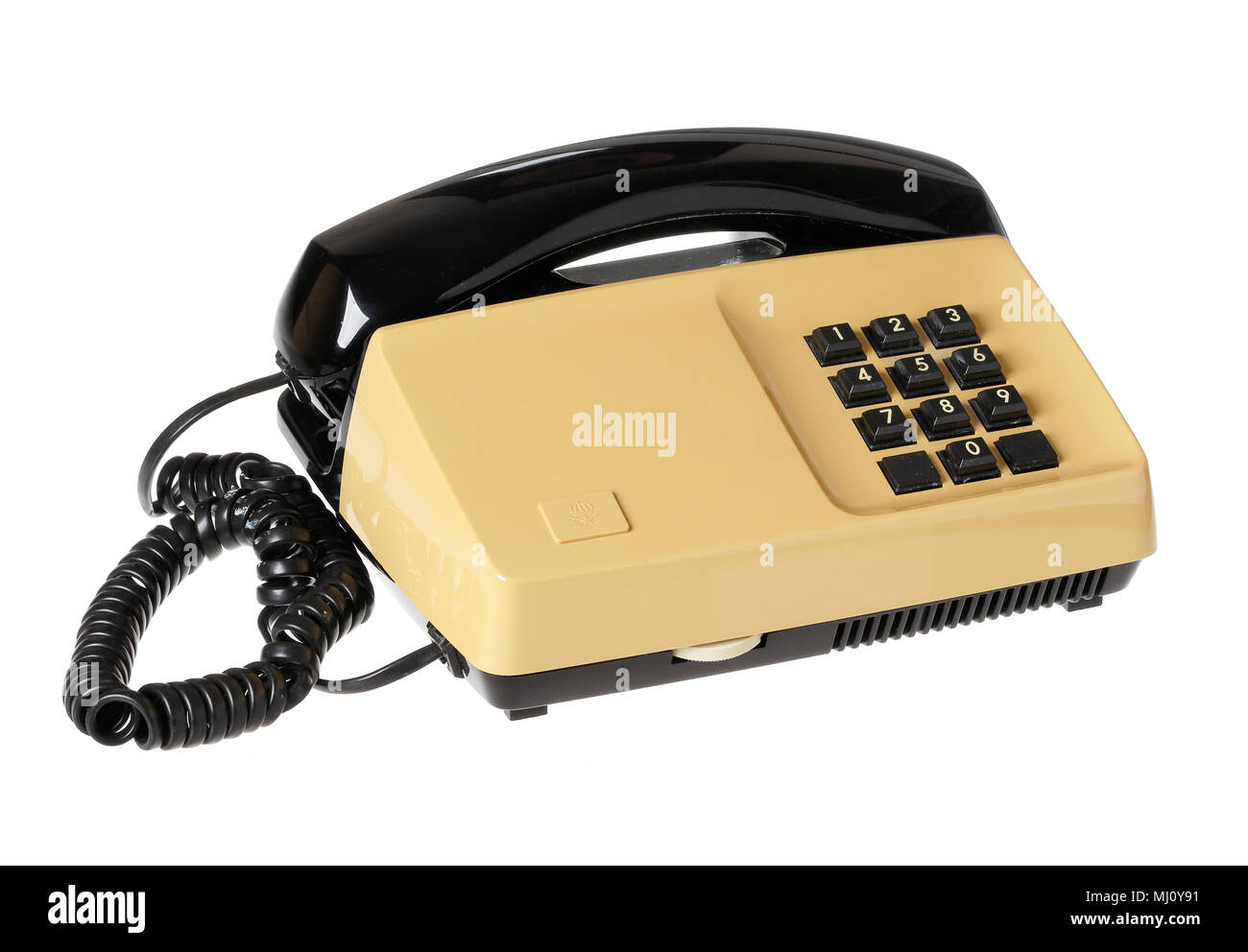 Old 1970s telephone with keypad  isolated on white. Stock Photo