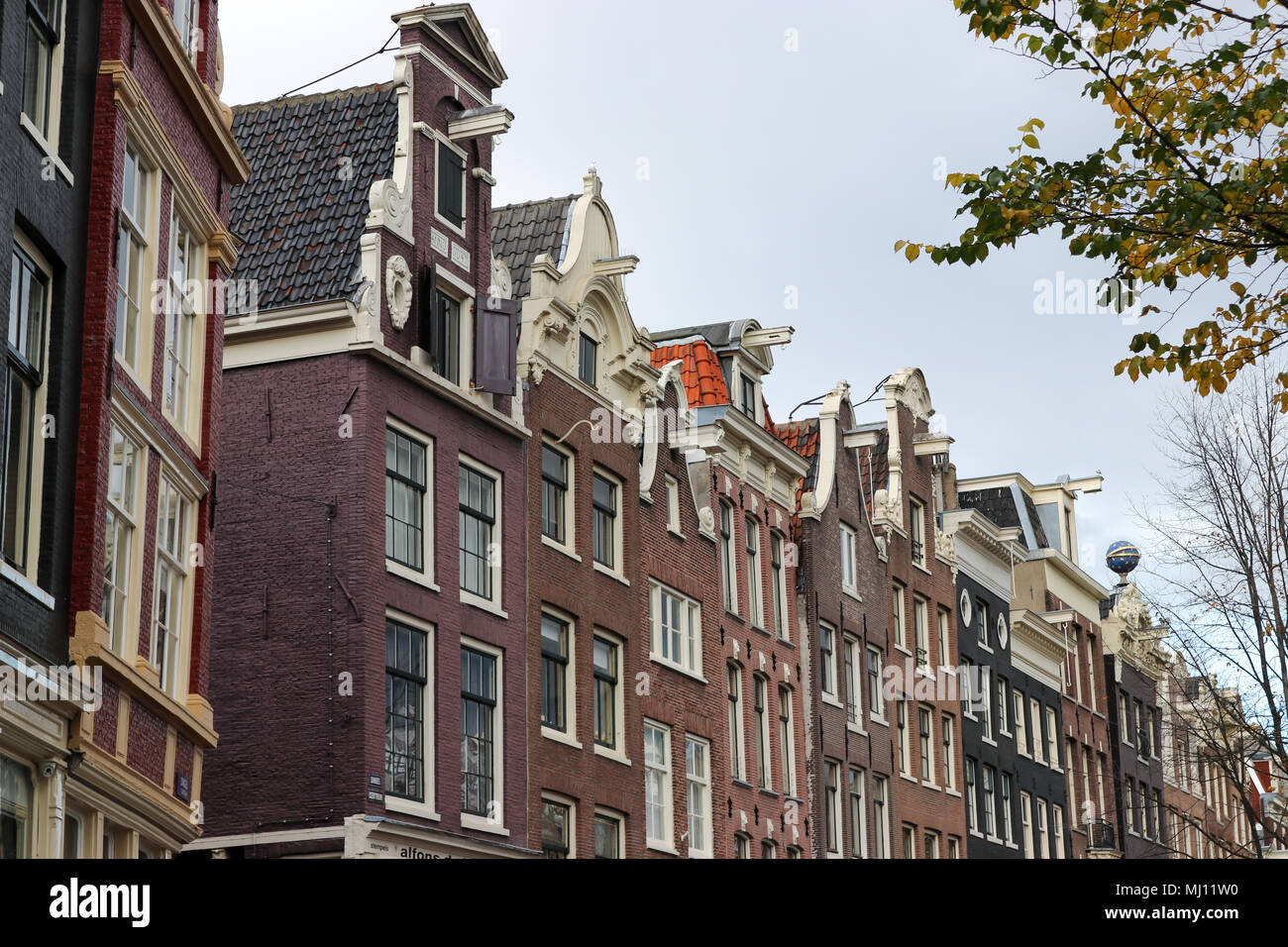 Dutch architecture. Gabled facade town houses along the canals in Amsterdam, Netherlands, Europe in the Autumn. Stock Photo