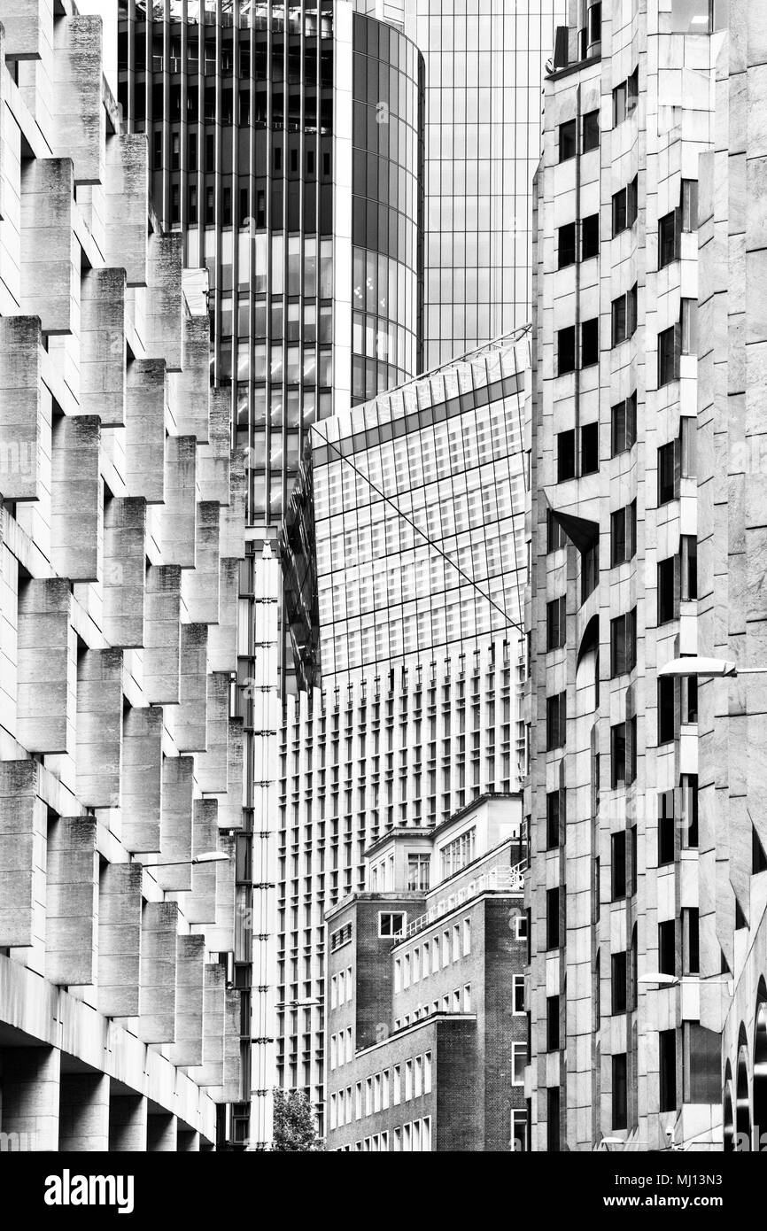 Old and new buildings abstract. Mincing lane, London, England. Black and white Stock Photo