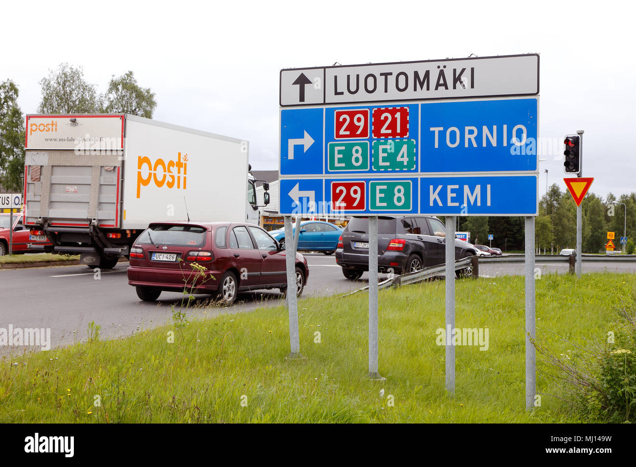 Direction signs with road numbers of stack type at road junction with traffic lights near Tornio, Finland Stock Photo