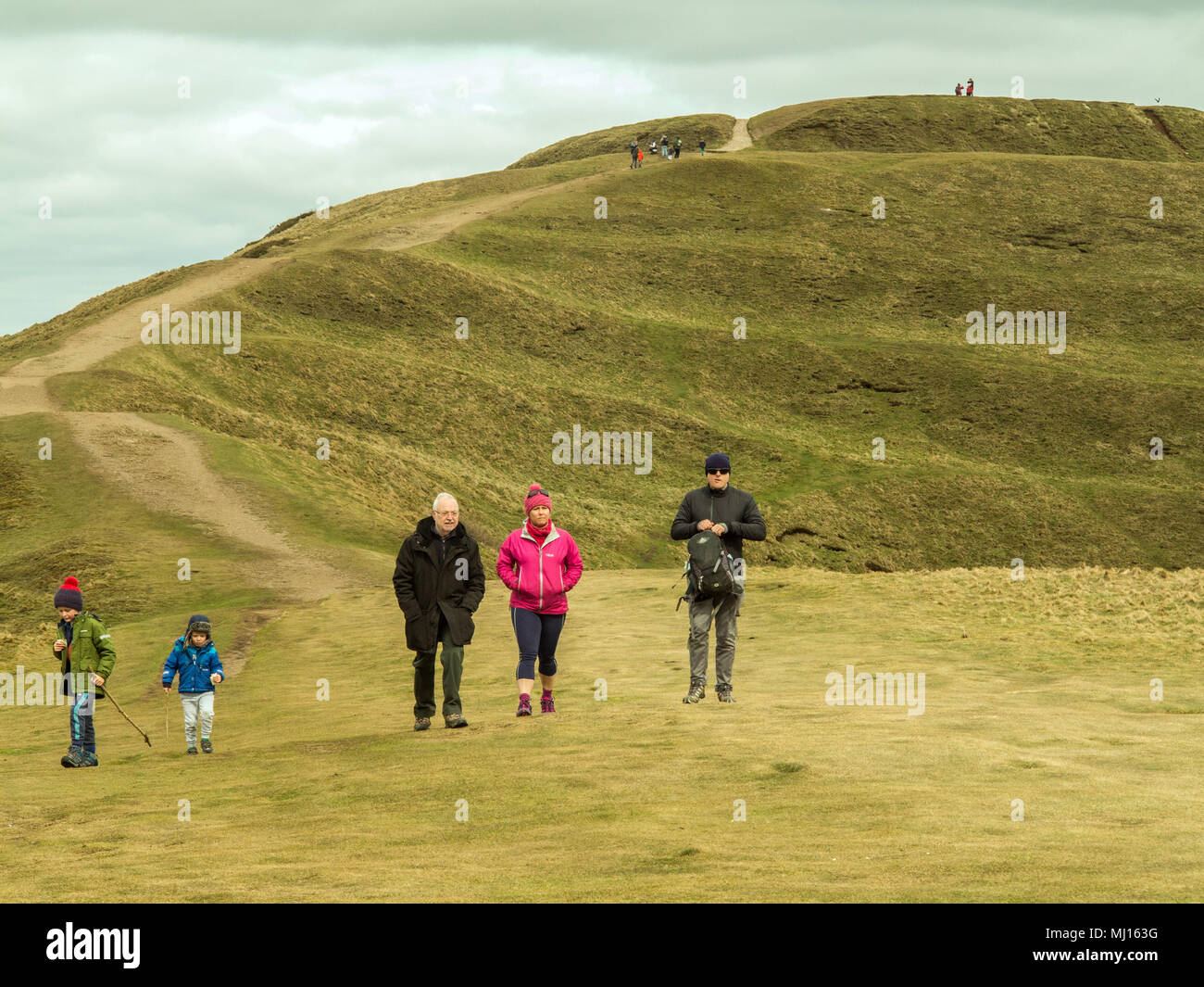 Men women children and families walking and rambling in the countryside  along the ridge of the Malvern Hills in Worcestershire England UK Stock Photo