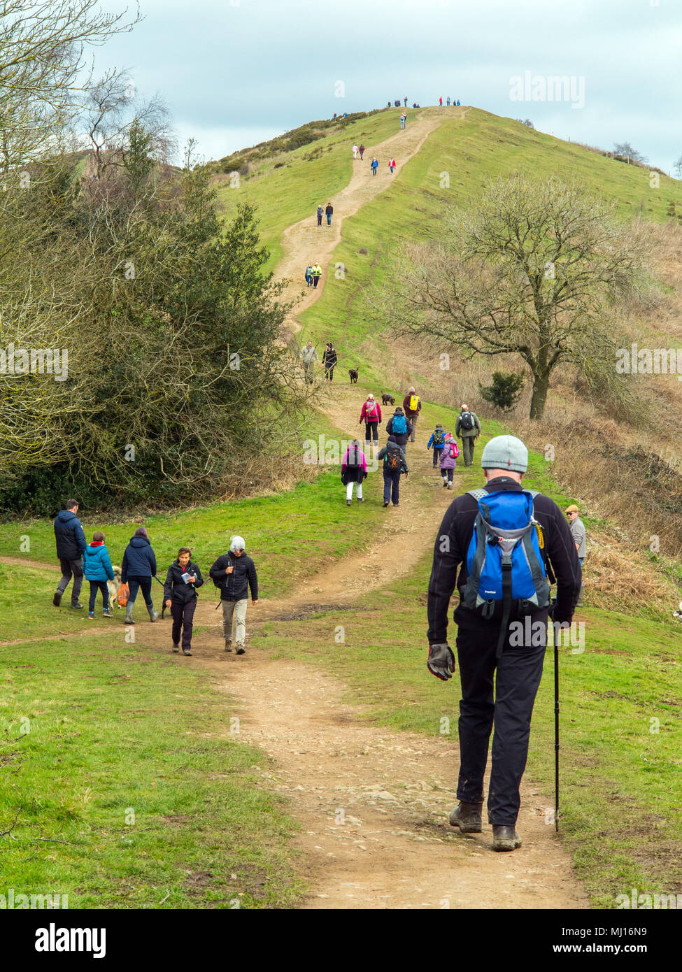 Men women children and families walking and rambling in the countryside  along the ridge of the Malvern Hills in Worcestershire England UK Stock Photo