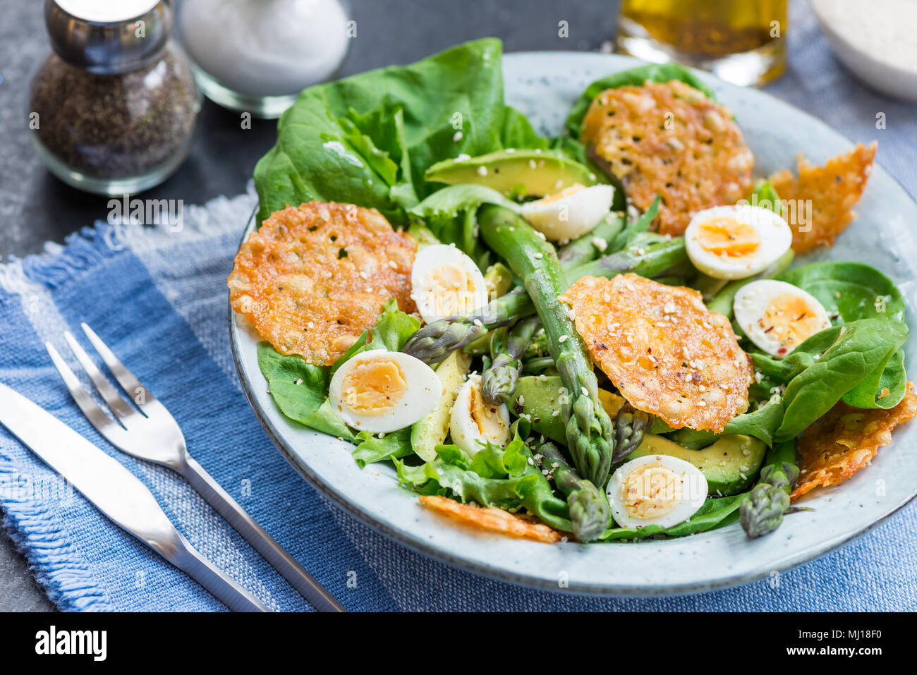 Asparagus Salad with quails eggs, avocado and cheese crisps, healthy
