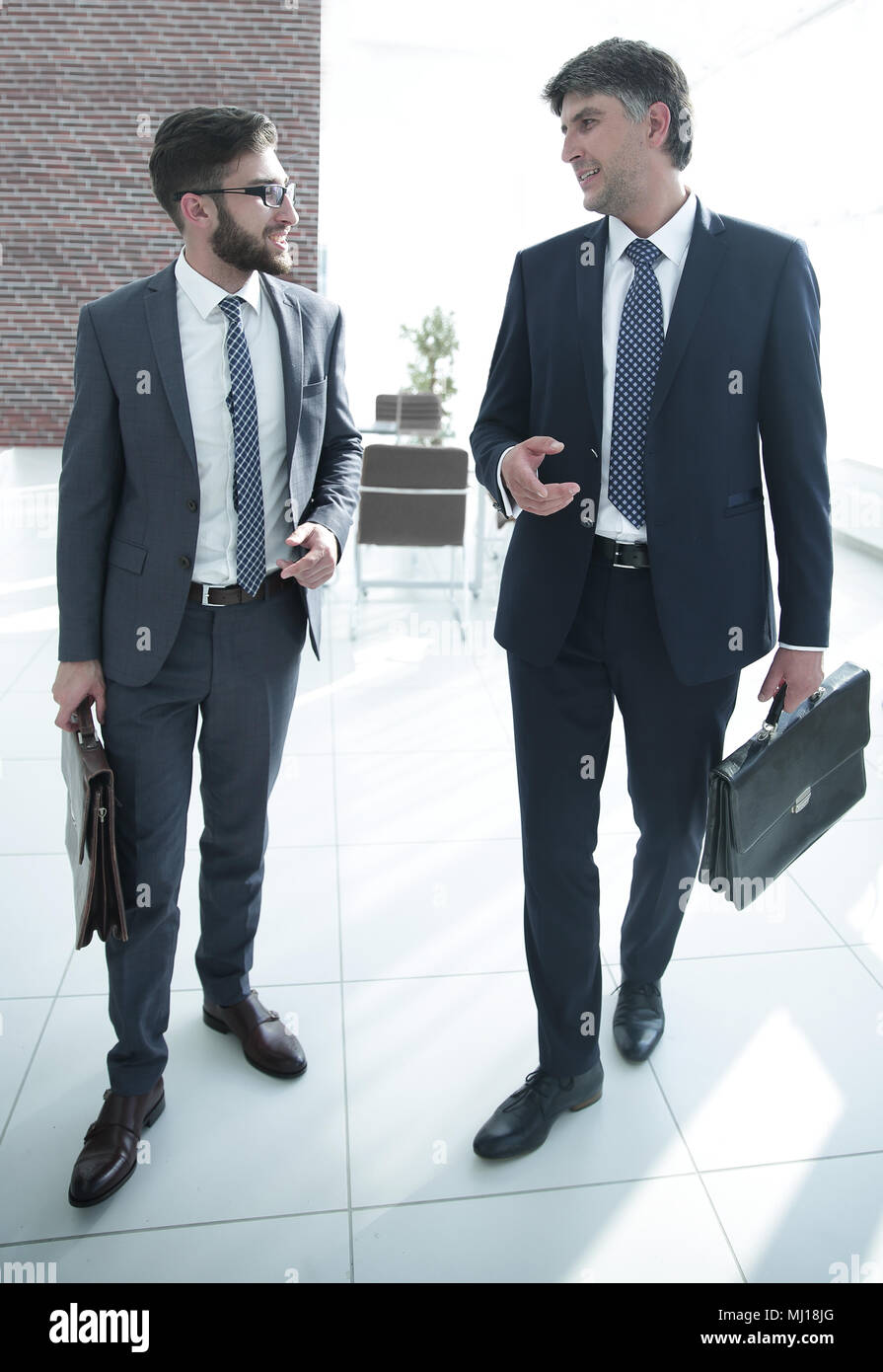 Two company employees discuss business issues Stock Photo