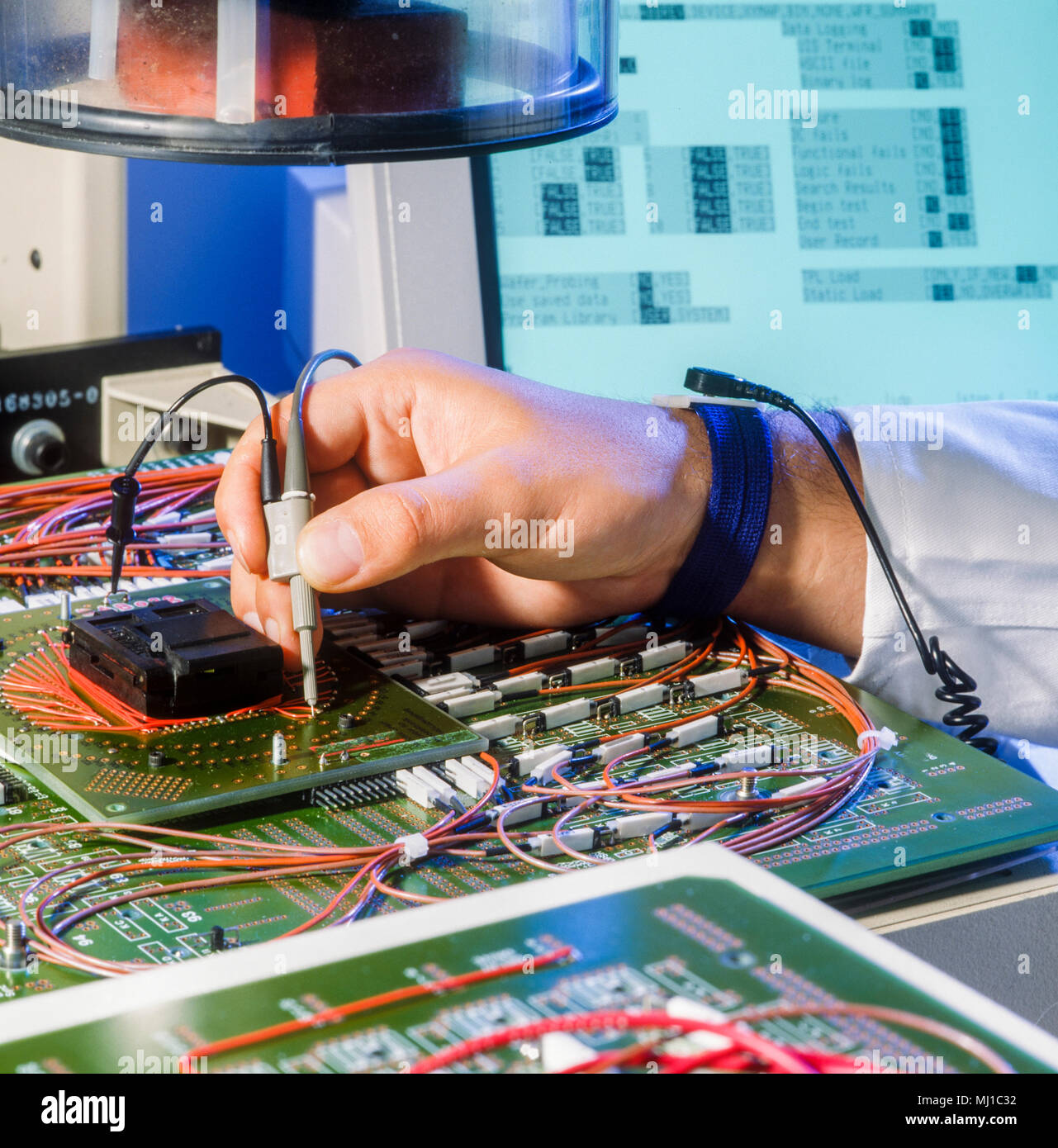Hands working in a electronic test and analysis labratory Stock Photo