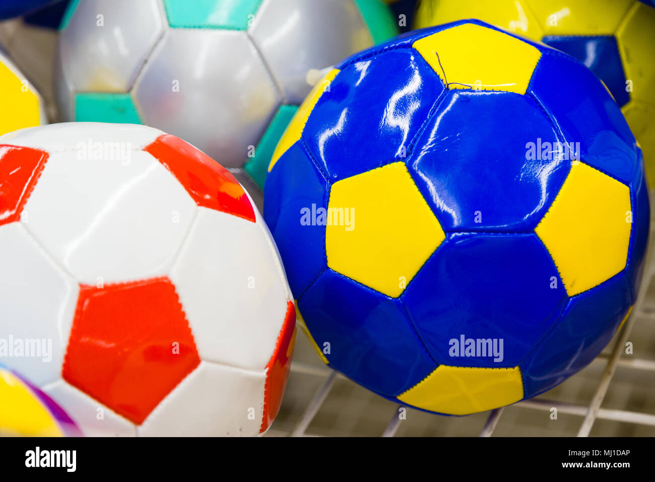 Colored soccer balls in the supermarket on sale Stock Photo Alamy