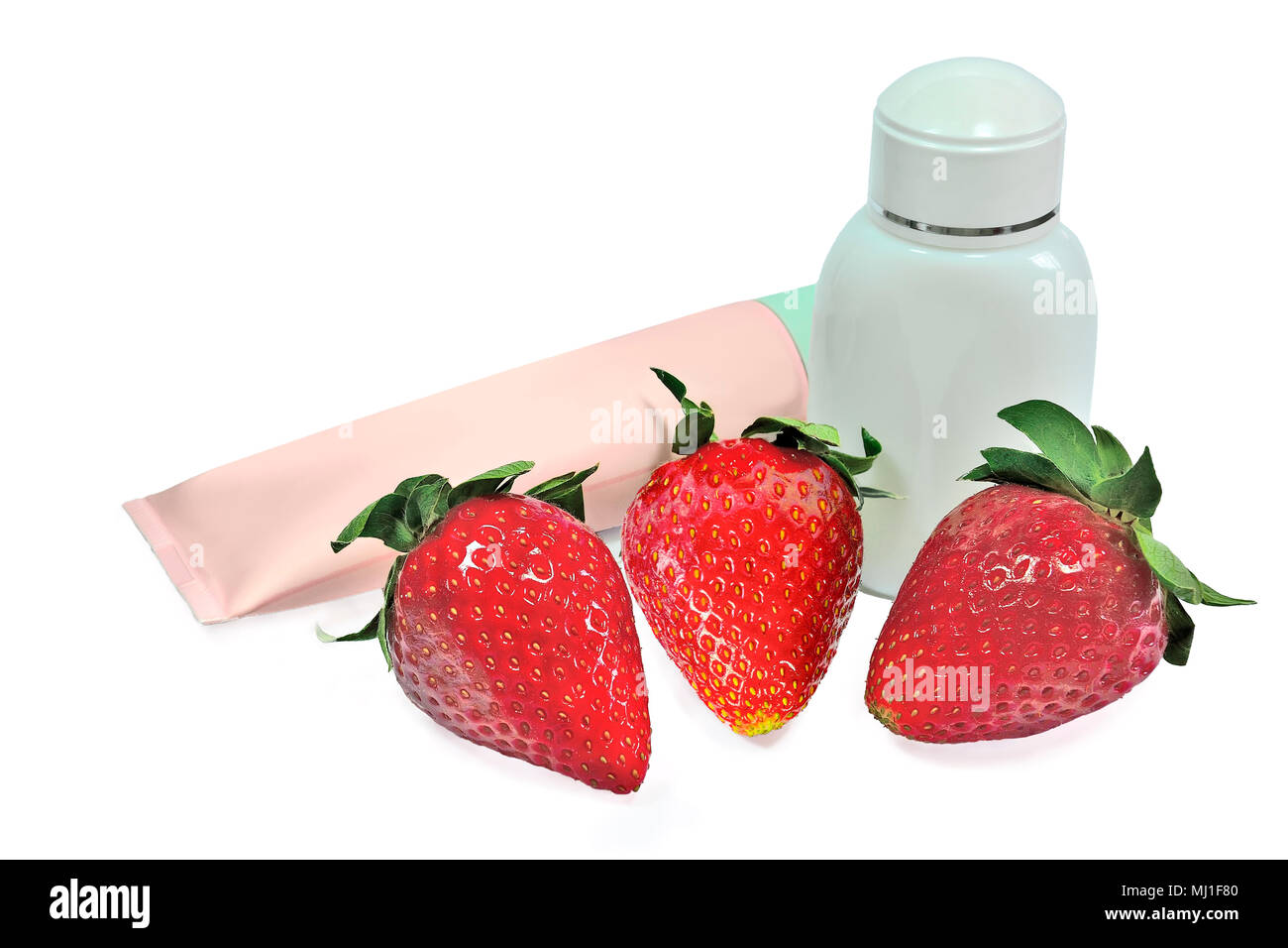 Natural cosmetic products with extract of strawberry: plastic tube with skin care cream or mask and bottle of gel, lotion or cosmetic milk, isolated o Stock Photo