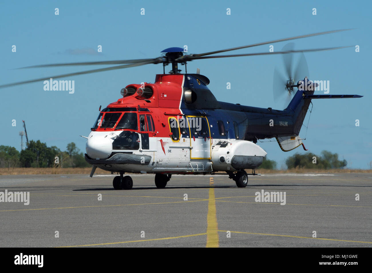 DARWIN, AUSTRALIA - AUG 2, 2006: Aerospatiale AS332L Super Puma helicopter from Canadian Helicopter Corporation (CHC) landing on Darwin Airport. Stock Photo