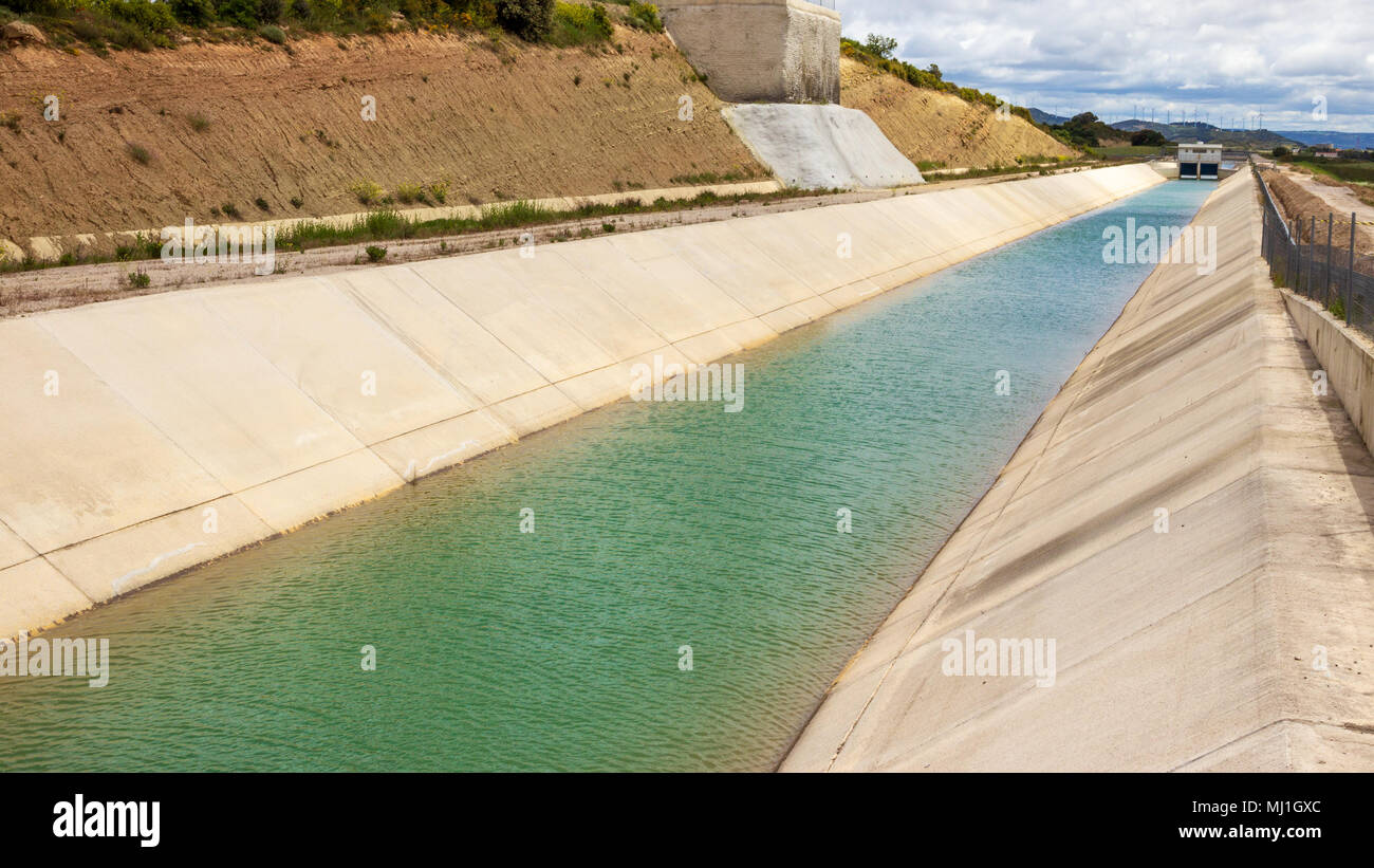 Agricultural concrete irrigation canal. Stock Photo