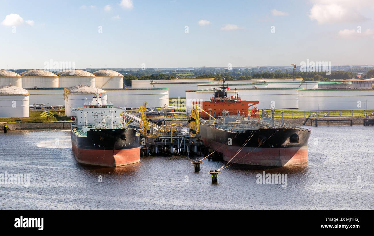 Oil tankers moored at an petrochemical oil shipping terminal in the Port of Rotterdam. Stock Photo