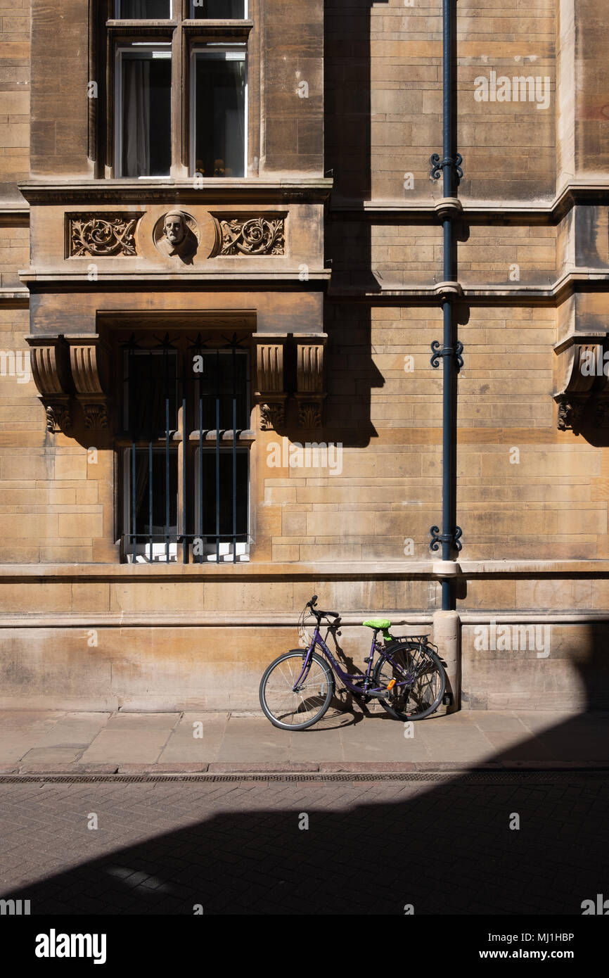 Bicycle parked outside a Cambridge college. Stock Photo