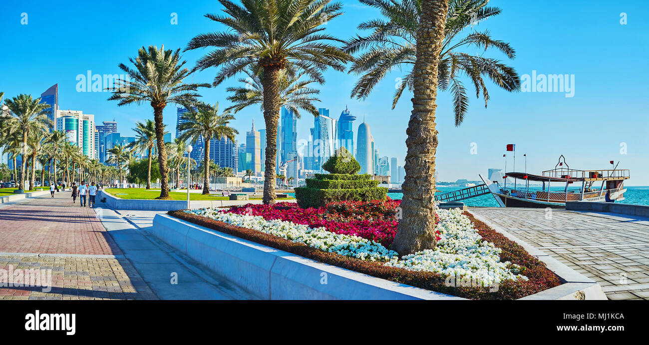 DOHA, QATAR - FEBRUARY 13, 2018: Panorama of seaside park with trimmed ...