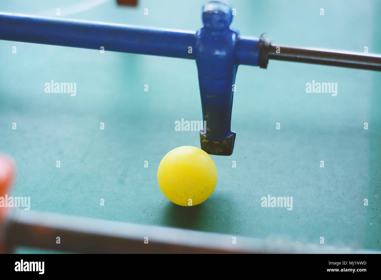 Foosball. Soccer table game, blue foosball player. Toy sport game concept Stock Photo Alamy