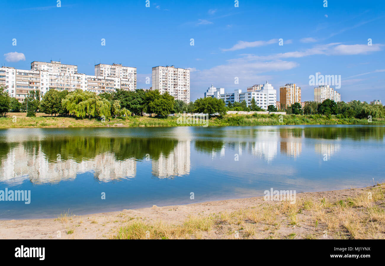 Residential buildings over a lake. Kyiv, Ukraine Stock Photo